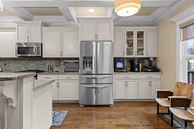 kitchen with white cabinetry, stainless steel appliances, and wood finished floors