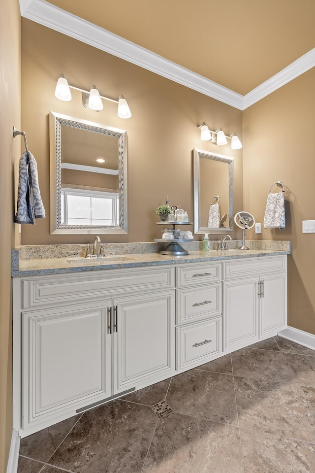 bathroom with double vanity, ornamental molding, and a sink