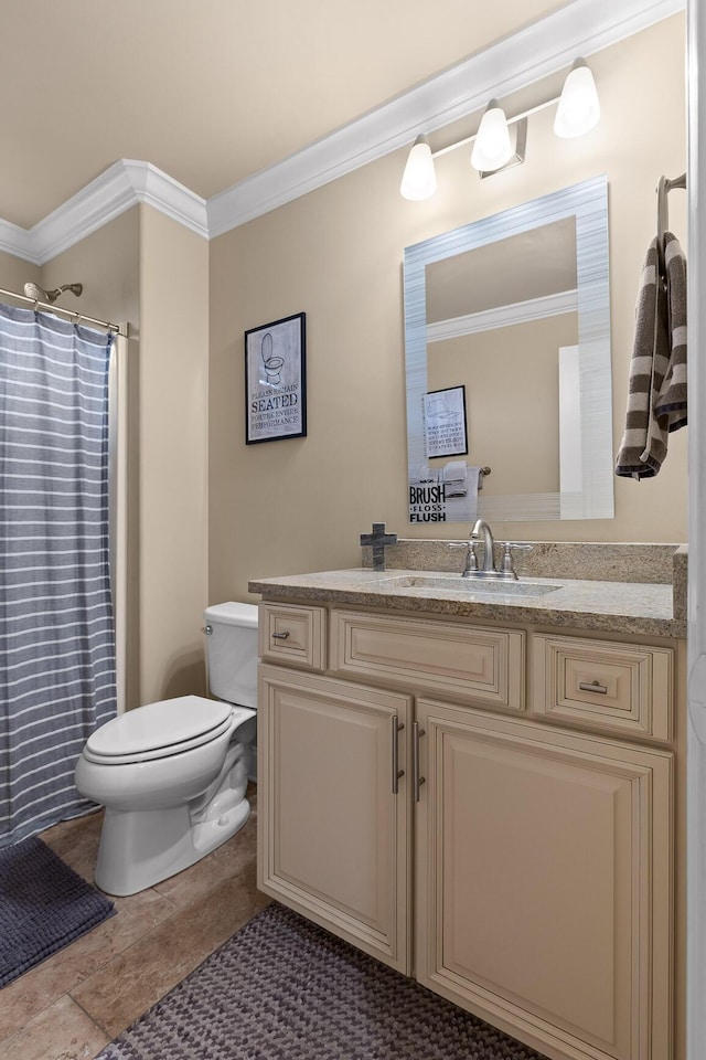 bathroom with ornamental molding, curtained shower, vanity, and toilet