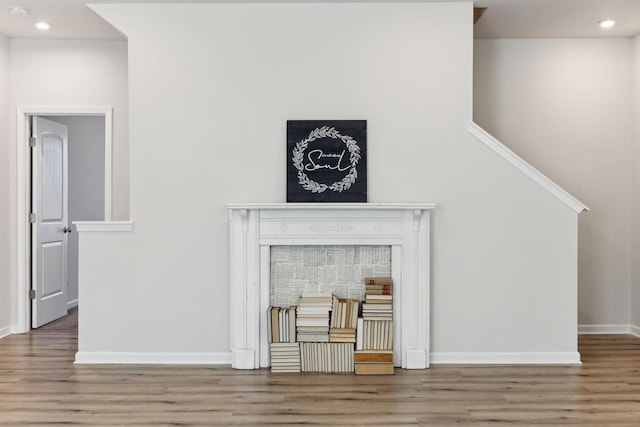 room details with recessed lighting, baseboards, and wood finished floors