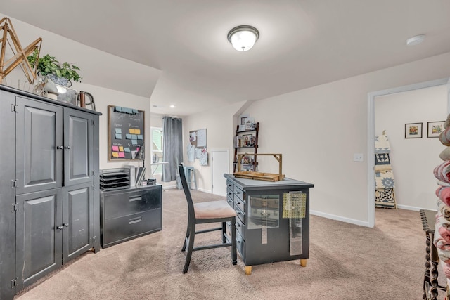 office space with light carpet and baseboards