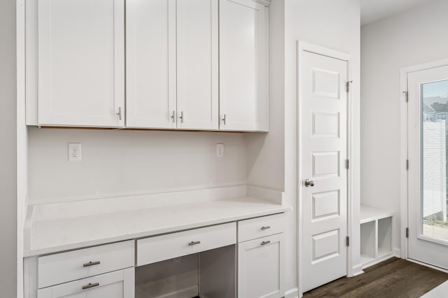 kitchen featuring dark wood-style floors and white cabinets