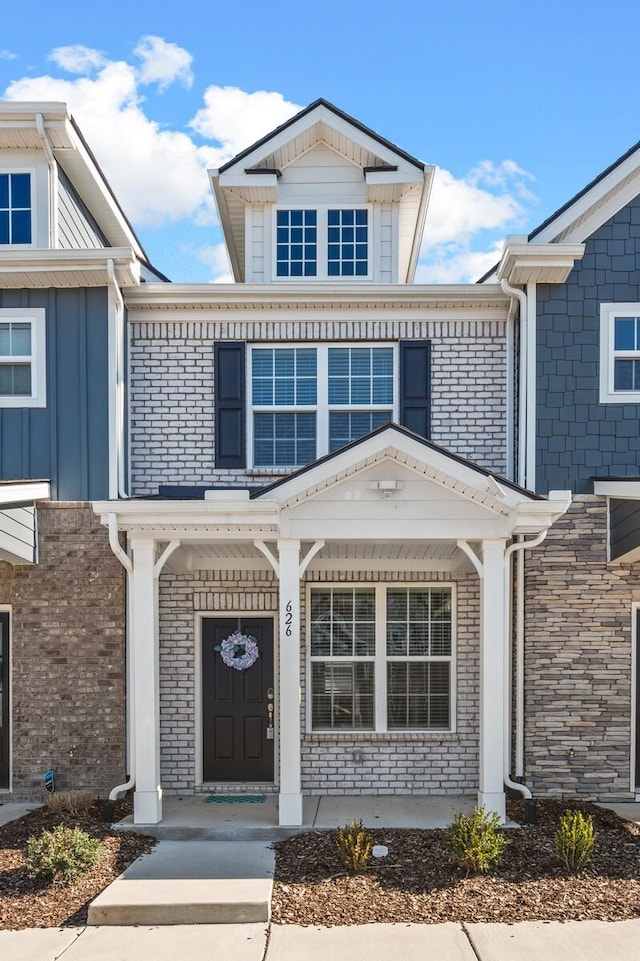 property entrance with brick siding