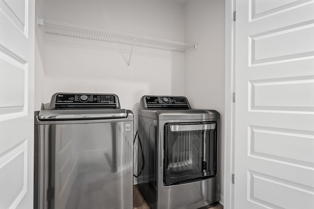 laundry room featuring laundry area and washing machine and clothes dryer