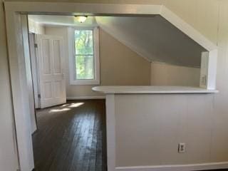 additional living space with dark wood-style floors