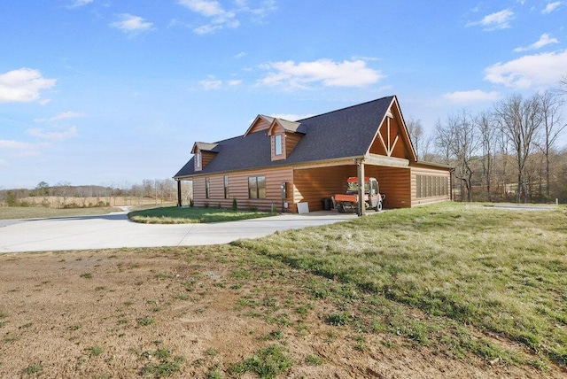 view of side of property featuring a lawn