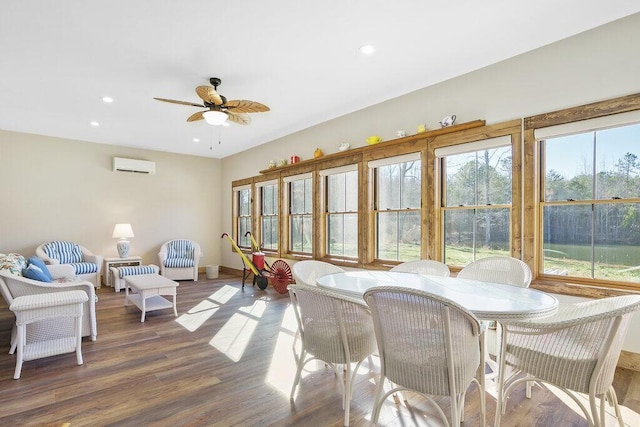 interior space featuring ceiling fan and a wall unit AC