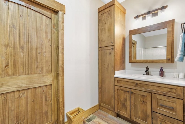 full bath with visible vents and vanity