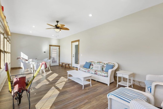 living area with ceiling fan, wood finished floors, and recessed lighting