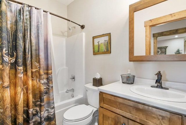 bathroom featuring toilet, shower / tub combo, and vanity