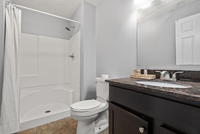 full bath with toilet, curtained shower, a textured ceiling, and vanity