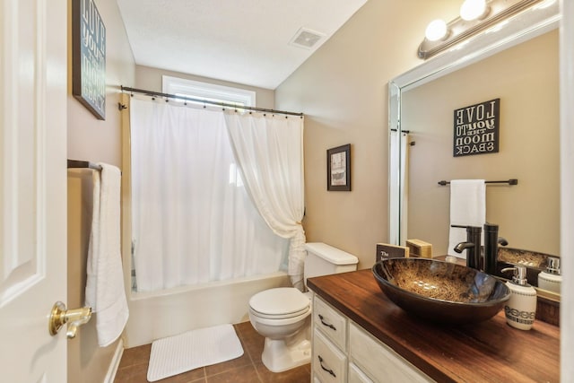 full bathroom with shower / bath combination with curtain, visible vents, toilet, vanity, and tile patterned floors