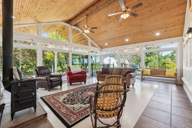 sunroom / solarium featuring wood ceiling, a wood stove, and vaulted ceiling with beams