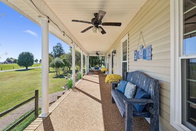 view of patio / terrace featuring ceiling fan and an outdoor living space