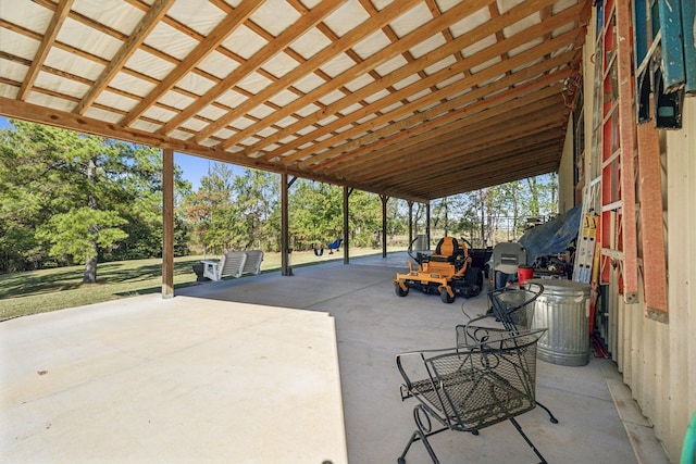 view of patio with a carport and concrete driveway