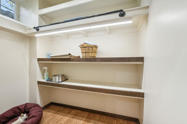 details featuring baseboards and wood finished floors