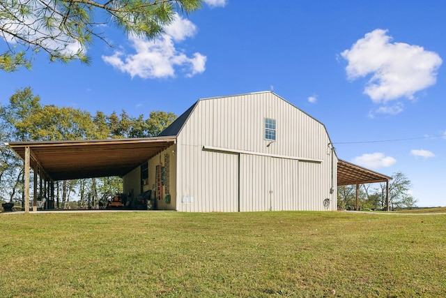 view of outdoor structure with an outbuilding and a carport