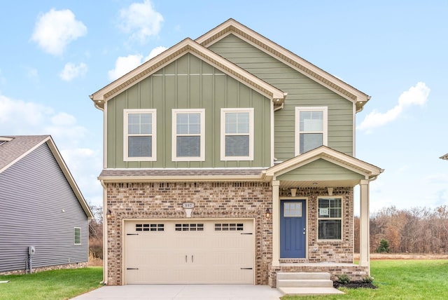 view of front of property with an attached garage, brick siding, driveway, a front lawn, and board and batten siding