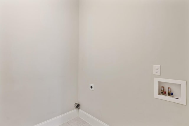 laundry area featuring light tile patterned floors, hookup for an electric dryer, laundry area, washer hookup, and baseboards