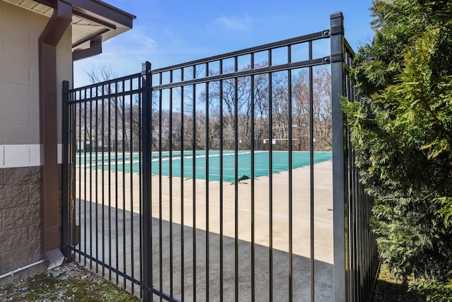 community pool featuring fence