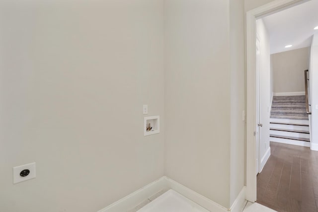 laundry room with baseboards, laundry area, hookup for a washing machine, and hookup for an electric dryer