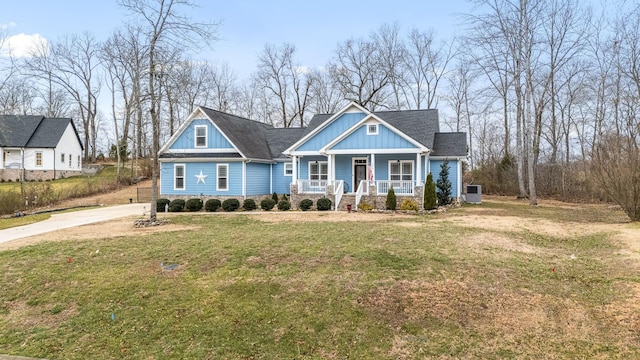 view of front of house with covered porch, board and batten siding, and a front yard