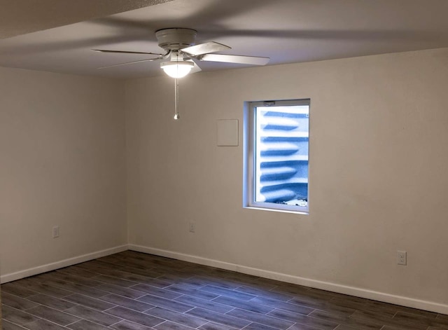 unfurnished room featuring a ceiling fan, wood finish floors, and baseboards