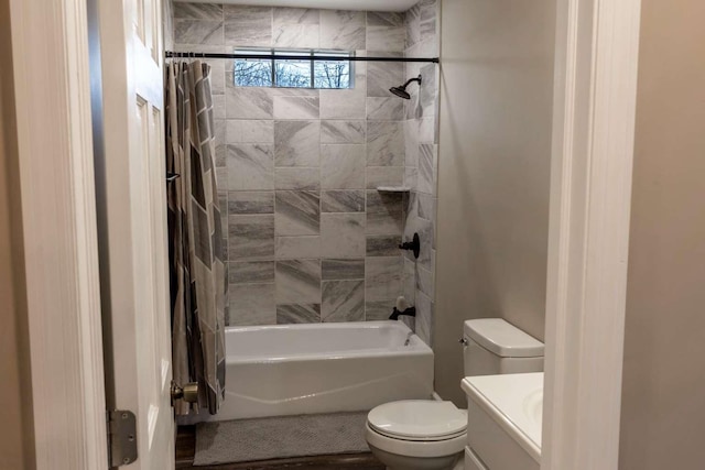 bathroom featuring shower / tub combo with curtain, vanity, and toilet