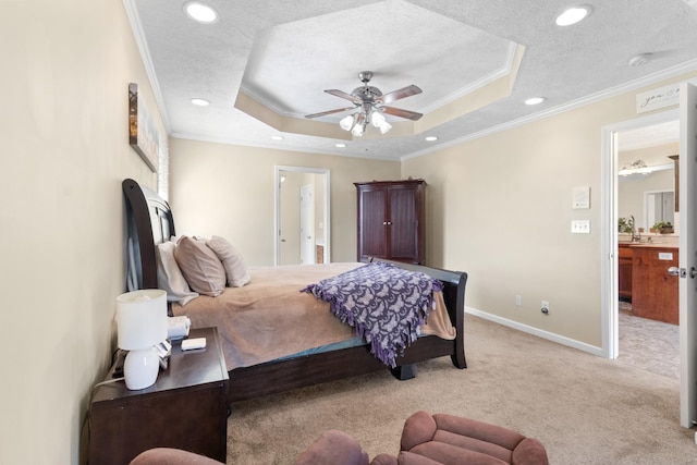 bedroom featuring a raised ceiling, light colored carpet, a textured ceiling, and baseboards