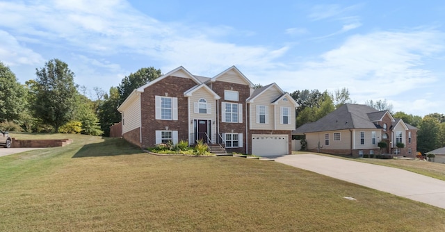 bi-level home with concrete driveway, brick siding, a front lawn, and an attached garage