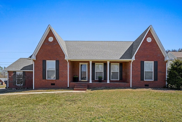 view of front of property featuring brick siding, crawl space, and a front yard