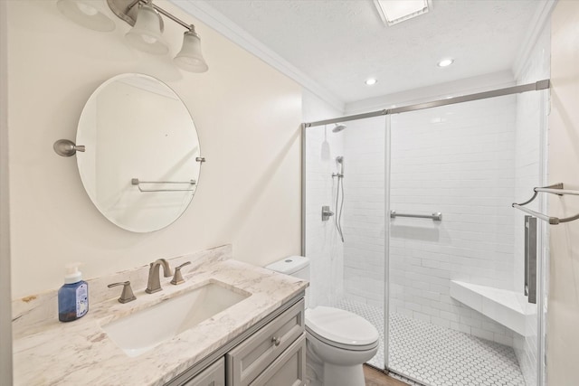 full bath with a textured ceiling, ornamental molding, a shower stall, and toilet