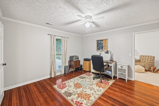 office with hardwood / wood-style flooring, visible vents, and crown molding