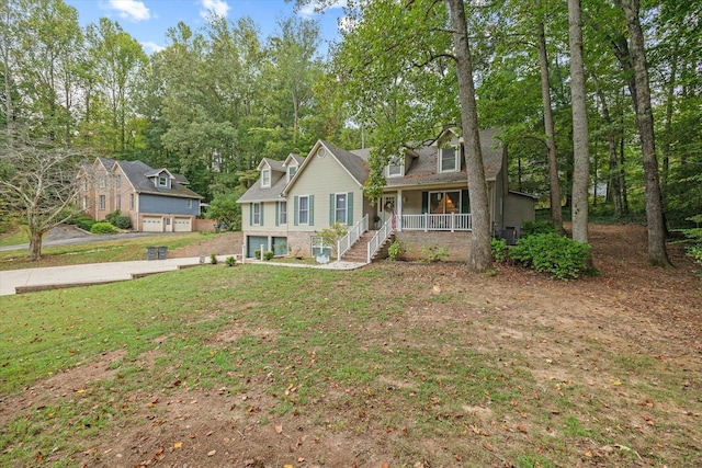 view of front of house with a front lawn and a porch