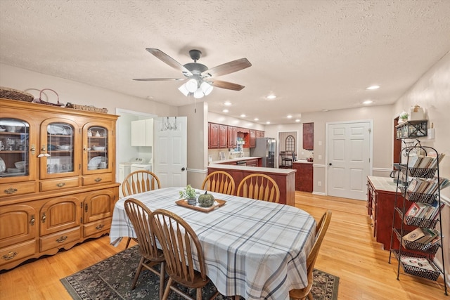 dining room with ceiling fan, washer / dryer, light wood-style flooring, and recessed lighting