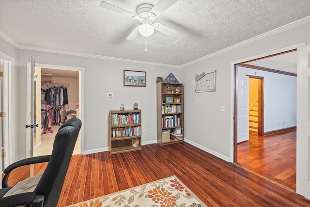 home office with wood-type flooring, a textured ceiling, ceiling fan, and crown molding