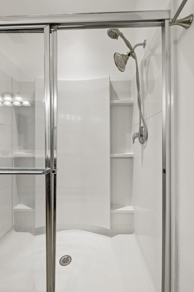 bathroom featuring a shower stall