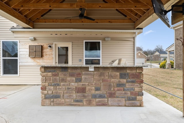 view of patio / terrace with exterior kitchen and ceiling fan