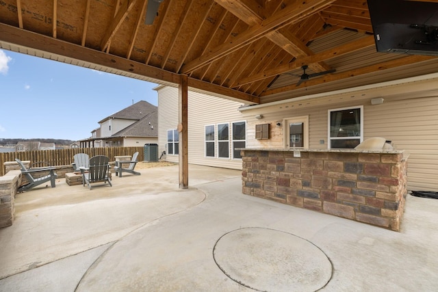 view of patio / terrace featuring central air condition unit, ceiling fan, and fence