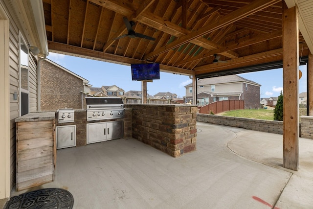 view of patio / terrace with ceiling fan, an outdoor kitchen, grilling area, and a gazebo