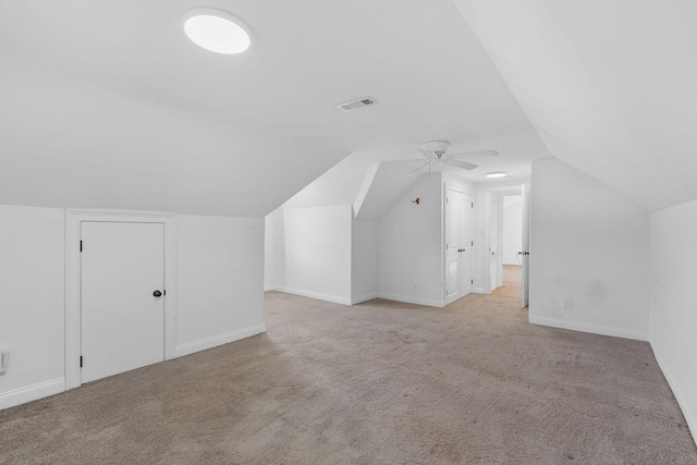 bonus room featuring vaulted ceiling, carpet floors, visible vents, and baseboards