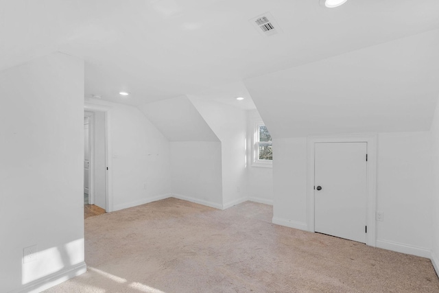 bonus room featuring visible vents, vaulted ceiling, carpet flooring, and recessed lighting