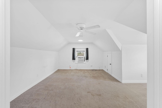 bonus room featuring ceiling fan, cooling unit, carpet floors, baseboards, and vaulted ceiling