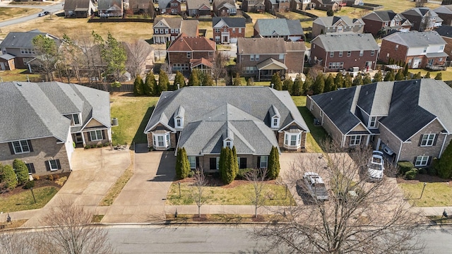 birds eye view of property with a residential view