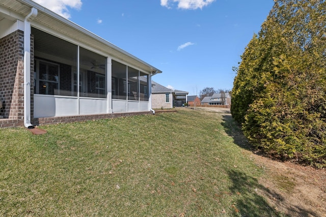 view of yard with a sunroom