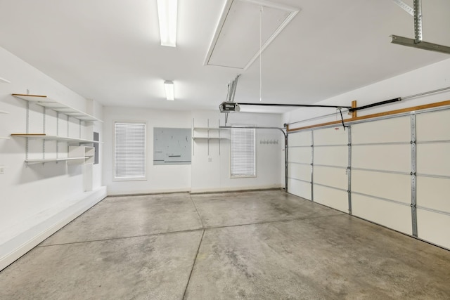 garage with baseboards and a garage door opener