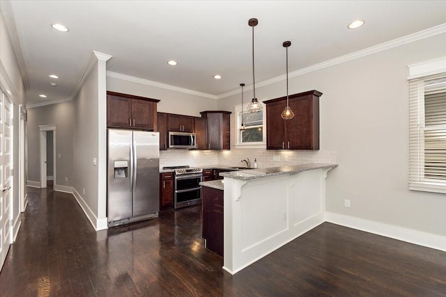 kitchen with dark brown cabinetry, stainless steel appliances, dark wood-type flooring, a peninsula, and a sink