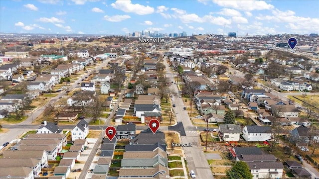 birds eye view of property with a view of city and a residential view