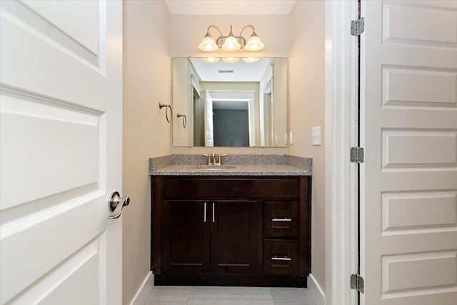 bathroom with visible vents, baseboards, and vanity