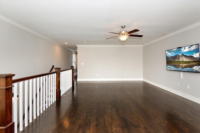 spare room with a ceiling fan, baseboards, ornamental molding, and wood finished floors